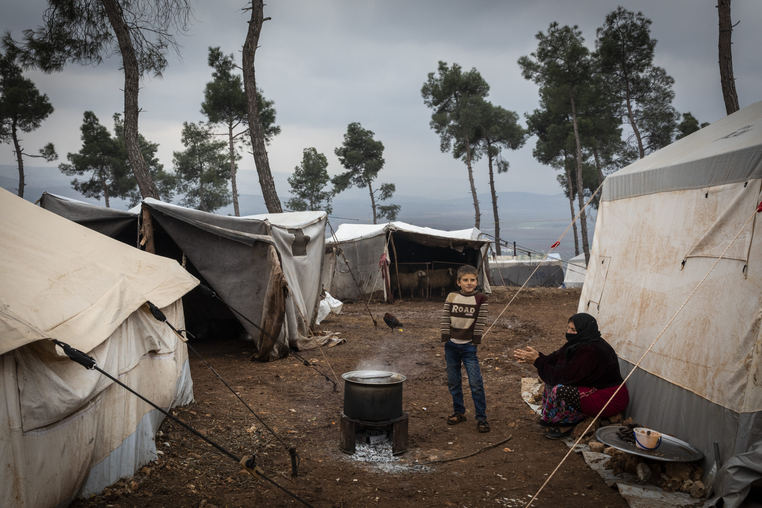 Refugees displaced during a 2020 Syrian regime offensive in nearby Idlib now living in a sprawling tented camp on a muddy hill above the city of Afrin.
PHOTO: Ivor Prickett/Panos Pictures